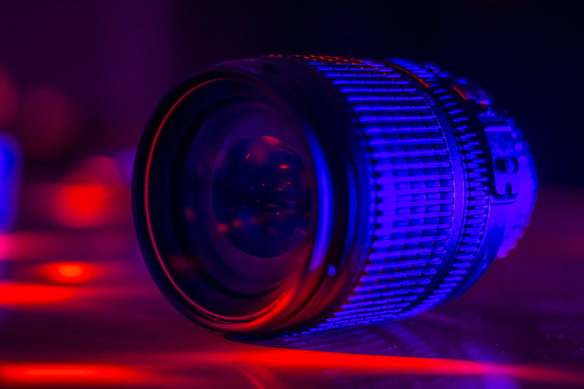 A camera lens in club style lighting.